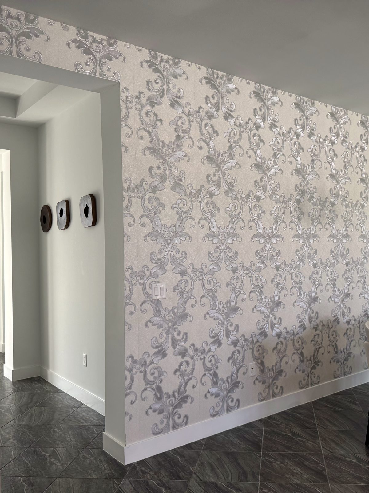 Damask feature wall, dining room. A full-height wall run past an open doorway, with the pattern repeat holding true across the return.
