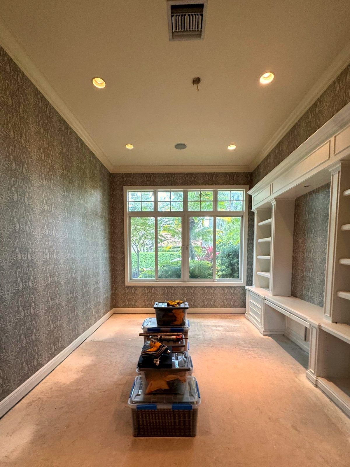 Dressing room. A quiet texture carried the length of the room with no seam falling on a door frame.